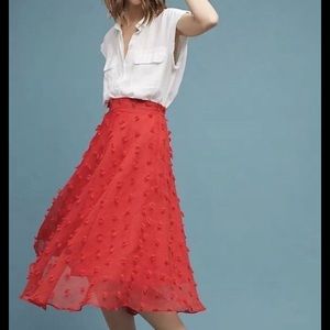 Red textured midi skirt by Style Keepers.
